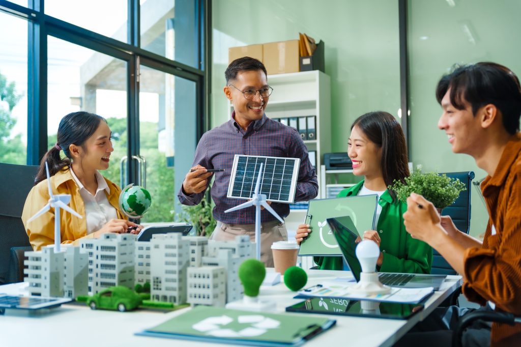 Colleagues meet at desk brainstorm environmental management strategies. discuss carbon emissions
