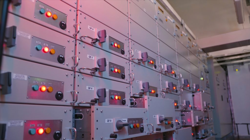 Electric control station shield. Action. Industrial electrical equipment with multiple control cells